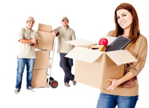 Employee wearing PPE while handling storage items at Newaddington Storage