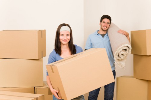 Efficient packing team preparing office items for transport